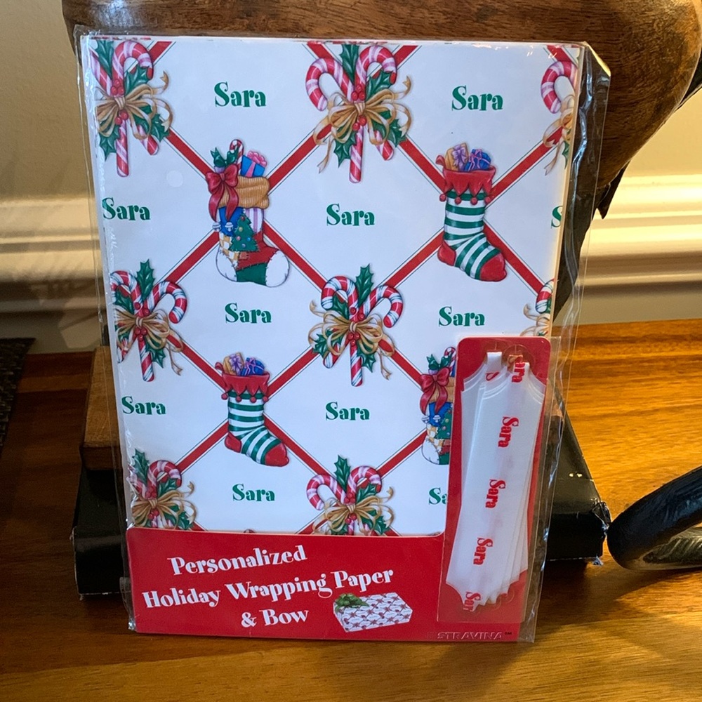 Pack of vintage personalized “SARA” Christmas wrapping paper and Pull Bow.  NEW